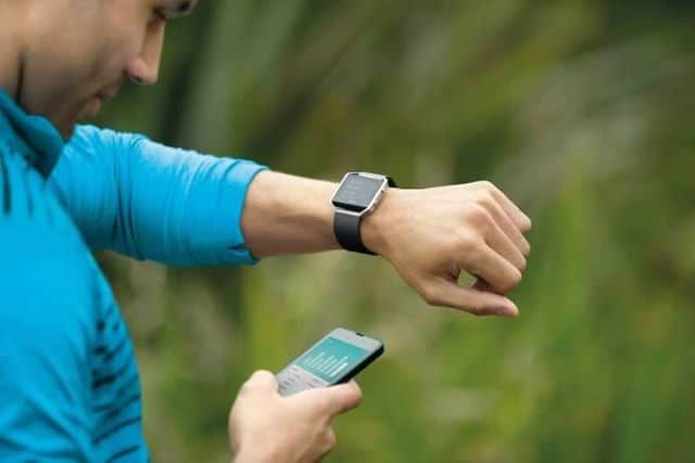 a man looking at his watch