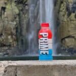 one bottle of red white and blue prime next to a Waterfall